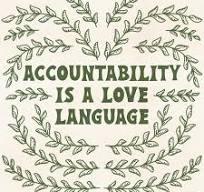 Sign reads, "Accountability is Love."
